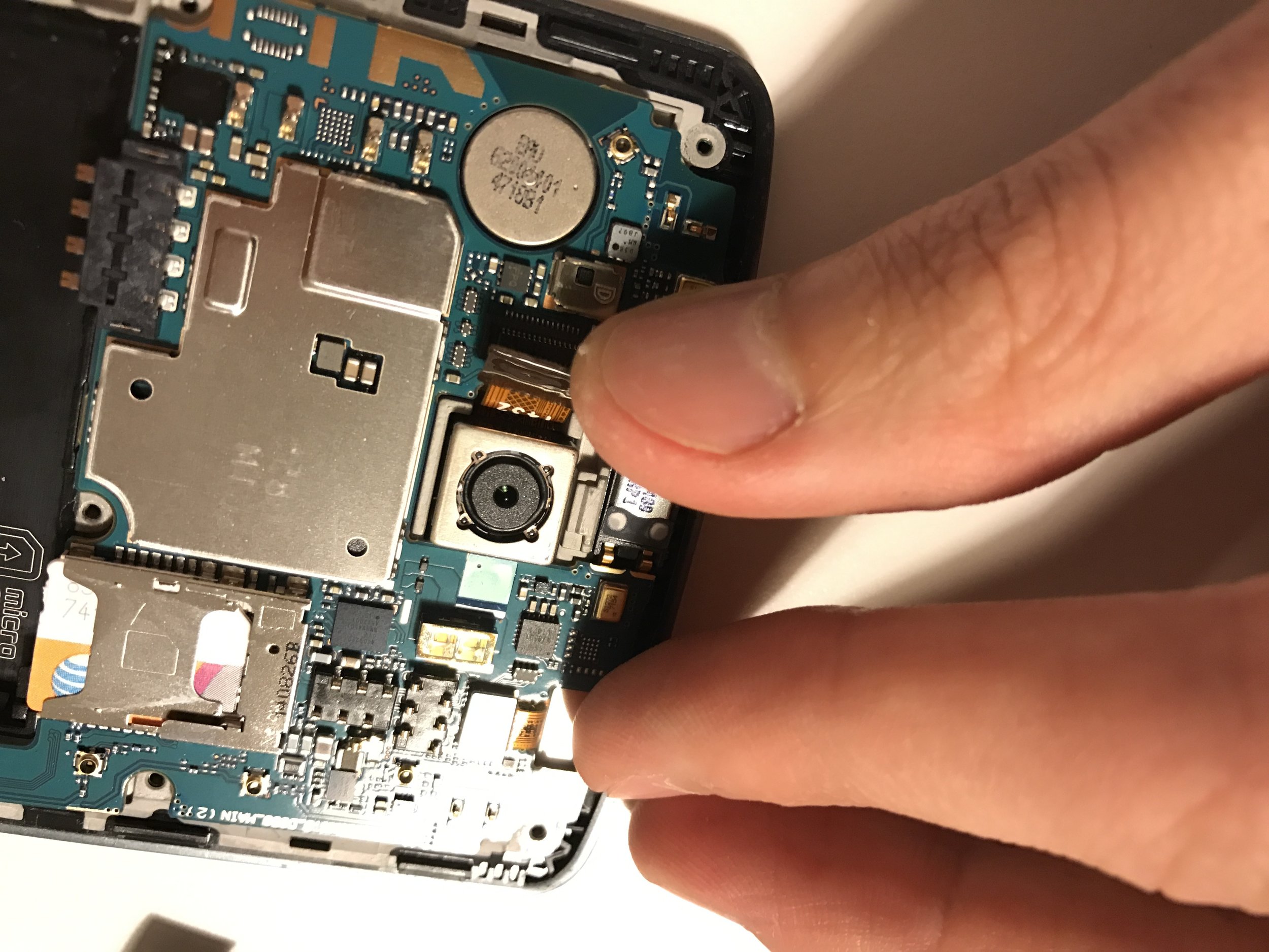 Phone motherboard in Pyrex dish